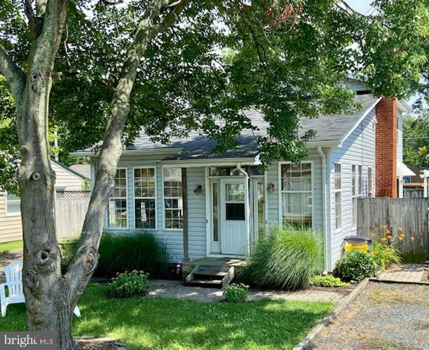 Water views of the Chesapeake Bay!  Bright & inviting three-bedroom/two-bath beach cottage with tons of charm!  Vaulted ceilings, hardwood flooring on the main level, SS appliances, wood-burning stove, two main level bedrooms & one upper-level master ensuite, and laundry room.  Windows throughout provide beautiful natural lighting and fresh breezes coming from the water!  Exterior features include a back deck with pergola, built-in firepit, fully fenced yard with flat grassy area, and two storage sheds. Double driveways perfectly fitting your cars/trucks and your boat!  Enjoy the private community water access & amenities of Snug Harbor: waterfront playground, boat launch, docks/piers, and annual community festivities!  Escape to the water & make this vacation cottage your everyday adventure!   Deadline for all offers by 3:00pm Sunday 6/27.