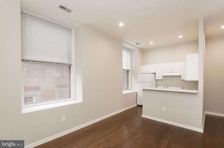 Welcome to The Empire Building! This charming, value-priced one-bedroom apartment offers incredible space and NATURAL LIGHT, making it the perfect place to call home. The OPEN-CONCEPT layout features a generous living and dining area, creating a comfortable and inviting space ideal for both relaxing and entertaining. The modern kitchen is seamlessly integrated into the living area, offering AMPLE ROOM for meal preparation and cooking. For those who enjoy dining in, eat-in kitchen options are available. The spacious bedroom is thoughtfully proportioned, providing plenty of room for rest and relaxation, and the full bath is beautifully tiled with ceramic finishes for a sleek, clean look. Bay windows throughout the apartment (On select units) fill the space with natural light, adding to the airy, open feel.
The apartment also offers modern conveniences, including ON-SITE LAUNDRY FACILITIES, an online resident portal for rent payments and work order entries, and a PET-FRIENDLY environment. The Empire Building is IDEALLY LOCATED near numerous local attractions, such as the Philadelphia Museum of Art, The Franklin Institute, City Hall, The Convention Center, Walnut Street shopping, and the scenic Benjamin Franklin Parkway. For students and professionals, MAJOR UNIVERSITIES including Drexel University, the University of Pennsylvania, Thomas Jefferson University, Temple University, and the University of the Arts are all nearby.
Living in the heart of Midtown Philadelphia means being surrounded by some of the city’s best culinary experiences and vibrant nightlife. Known for its bustling atmosphere, Midtown offers a fun and exciting place to live, with world-class restaurants and entertainment just steps away. Enjoy easy access to hotspots like Rittenhouse Square Park's Farmer’s Market, Fogo de Chão, Del Frisco’s, Ocean Prime, Harp & Crown, 1518 Bar & Grill, and Davio’s—all within a few blocks, offering a variety of dining experiences for every taste.
With a Walk Score of 100, you’ll find that getting around is a breeze, thanks to easy access to the Market East SEPTA station, SEPTA bus routes, and major highways I-95 and I-76. Whether you’re enjoying the cultural gems, dining at incredible restaurants, or simply soaking in the energy of the city, The Empire Building provides a prime location for a vibrant, city-centric lifestyle. Please note: Photos shown are of a model unit. Actual finishes and layout may vary. Pricing and availability are subject to change.