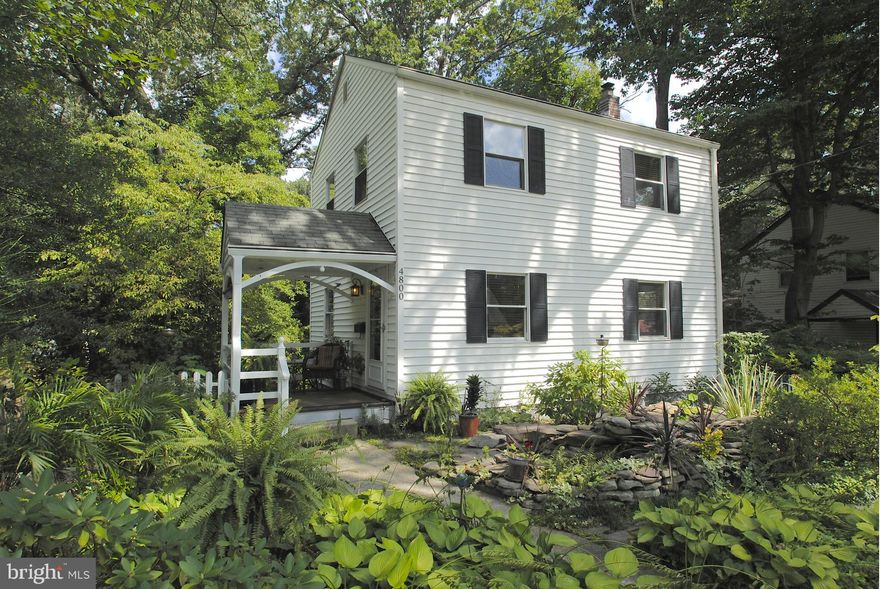 Move In Ready-Immaculate 4br/2ba w/ superb attention to detail: push-button light switches, mosaic floor tile, crown-molding, + HW floors. Custom kitchen will delight chefs/entertainers alike with solid wood cabinets, S.S. appl., quartz cntrtp, and GE gas stove. Off the kitchen is a deck overlooking private wooded backyard. Front yard features tranquil pond w/waterfall and side porch.