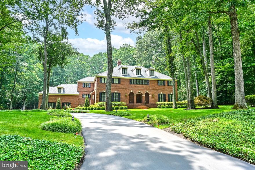 Exceptional price for a lifestyle property that is the perfect private retreat combining location, presence, design, comfort and appointments that marry beautifully to create a haven of peace and privacy less than 10 miles to downtown Annapolis.  Quality materials and craftsmanship abound in this superbly maintained home and grounds.  Stately hardwood trees, and a graceful hydrangea-lined driveway beckon you to visit.  Solid mahogany doors and marble flooring welcome you to a floor plan designed for an exceptional lifestyle.  Walls of windows overlook patios, terraces, and a sumptuous in-ground pool surrounded by manicured grounds.  The well appointed gourmet kitchen features two cooking areas--gas and electric--stainless steel appliances, quartz counter tops, ample storage and built-in cafe and window seating.  The adjoining Family Room opens to pool and patio.  A main level Bedroom with Bath ensuite and Office/Bedroom offer opportunities for transitional work and living possibilities.  The Primary Bedroom with sitting area enjoys access to its own private balcony that enjoys expansive pool and garden views.  Separate whirlpool bath, shower rooms and dressing areas create a unique suite experience.  A full upper level suite affords comfort and privacy for company, in-laws, au-paire.  The full lower level offers more entertaining possibilities and an abundance of storage. Four-zone HVAC, two central vacuum systems, automatic start generator, 16-zone lawn and garden water sprinkler system and so much more make this property a well-managed and superbly maintained jewel.  Three-bay garage is generously proportioned, fully finished and temperature-controlled; and the covered parking port easily accommodates a large RV or boat!  This is truly a unique property rarely found in one's lifetime.