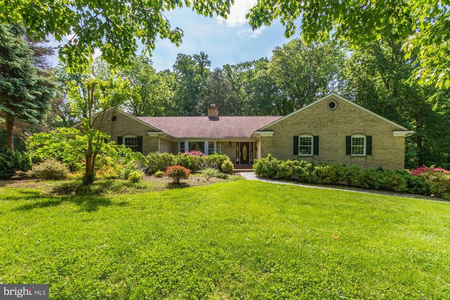 Absolutely terrific one level living w/generously proportioned rm sizes incl a big, open Kitchen/Family Rm. Renov kitchen w/white cabinetry, top of the line appliances, center island & a huge breakfast area. Master Sitting Rm could be addt'l BR. 5th BR or Library w/en suite full bath main.  Major recreation rm w/daylight, walk-out lwr lvl. Screen porch overlooking TWO acres. Close-in location!