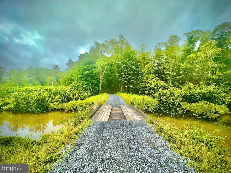 This 5.28 Acre lot is located directly across the newly upgraded road from Herrington Manor State park and the trail head for snowmobiling and hiking. Herrington Manor Lake is a short walk through the woods. Surrounded by over 25,000 acres this perc ready lot has electric and is part of the Lake Minnetoska informal HOA. Located only minutes from Oakland and 20 minutes from Deep Creek Lake your not far from shopping and dining or just stroll on the 3.5 mile long State Park ARV road.  If you love having wildlife around then you've found your home.