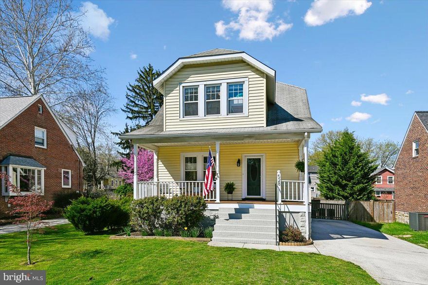Nestled on one of Anneslie’s most coveted tree-lined streets, this quintessential storybook cottage captures the perfect balance of nostalgic charm and crisp, modern updates. The journey begins on the deep front porch—an iconic neighborhood feature that offers a warm, timeless welcome. It is the ultimate vantage point for morning coffee or evening chats with neighbors, serving as a seamless bridge between the vibrant community outside and the serene sanctuary within.
Beyond the threshold, the home unfolds with an airy, sun-drenched feel. Original hardwood floors gleam under a thoughtful mix of natural light and modern recessed lighting, while the open staircase—rich with natural wood character—acts as a focal point for the main level. The layout is masterfully designed for the way we live today, flowing effortlessly from a cozy living room into a spacious dining area that cleverly incorporates a dedicated window-bench nook, perfect for a home office or a quiet afternoon read.
The completely modernized kitchen is a vibrant and inviting space, showcasing clean white Shaker-style cabinetry, a tile backsplash, and updated countertops. The light teal accent walls provide a lovely pop of color against the stainless steel appliances, and a central peninsula with a breakfast bar provides easy seating. The wood-patterned flooring flows into an incredibly convenient laundry and mudroom area, complete with a stacked washer/dryer and a full bathroom.  From here, you can access the back deck which overlooks a fenced-in, level backyard, driveway and garage.  
Ascending to the second level, you will find a beautifully updated and comfortable living space comprising three distinct bedrooms and a renovated full bathroom. Natural light fills each room through multiple windows.  All three bedrooms maintain a bright, clean aesthetic, creating peaceful retreats.  Completing the second floor is a pristine full bathroom that perfectly blends classic detail with modern renovation.
The finished lower level significantly expands the home's footprint, offering a versatile multi-purpose space that functions perfectly as a family media room, home gym, or any version you desire. To complete this level, a second full bathroom provides essential convenience.  Access to this space is easy via the updated staircase, which features modern wood-plank treads and chic vertical paneling, ensuring the basement feels like a seamless extension of the upper floors.
The private outdoor oasis is designed for both relaxation and effortless hosting. A spacious, elevated wooden deck overlooks the level, lush green lawn. Below, a large patio creates a second gathering zone, currently centered around a fire pit and cozy Adirondack-style seating.
The backyard is fully enclosed by a combination of classic picket and privacy fencing, making it a safe haven for pets and play. Beautifully maintained landscaping, including a line of mature arborvitae and a stunning, pink-flowered tree, adds seasonal color and a natural sense of seclusion. For those with a green thumb, a raised garden bed is ready for summer planting.
Functional features abound, including a detached garage with a charming teal-painted side door that mirrors the home's playful interior accents. A wide driveway leads to a wooden gate, offering ample parking and a clean transition to the garage. Whether you're hosting a summer barbecue on the deck or gathered around the fire pit, this backyard serves as a perfect extension of the cottage's inviting charm.
This beautifully detailed cottage flawlessly merges historic charm with practical, stylish updates.