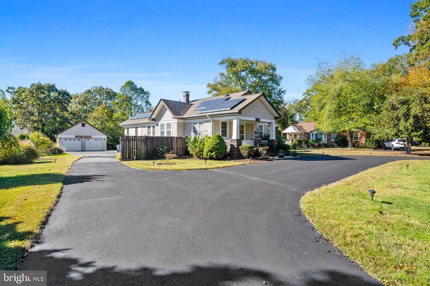 Step into timeless charm with this beautifully crafted 1930s Craftsman-style rambler, nestled on nearly ¾ of an acre of flat, lush green space in the heart of La Plata. This 3-bedroom, 2.5-bath home features a spacious primary suite with en suite bath, an updated kitchen, and a cozy fireplace perfect for relaxing on cool evenings. Enjoy the convenience of newer Leaf Gutter Guards and solar panels that enhance efficiency and value. The property also includes a detached 2-car garage with a half bath, loft storage above, ideal for a workshop, studio, or potential guest/income space if finished. A walk-up attic inside the home offers even more storage options. Located close to downtown La Plata’s shops, restaurants, and boutiques, and just minutes from the Park & Ride for easy commuting. Eligible buyers may also qualify for 100% USDA financing. A perfect blend of character, comfort, and convenience, all in one!