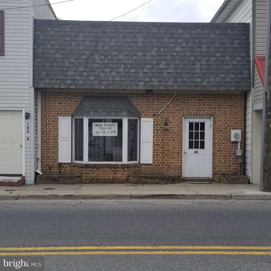 Lots of great possibilities  for this brick front building in town of Greensboro.  Located next door to the Greensboro Pharmacy and across the street from the police dept and Tenchi Restaurant.   Currently operated as a beauty salon and former tanning beds.   Once was a Real Estate office.  Close to town hall and plenty of public parking.  A large main room, one nice size bath, 3 smaller rooms, a large walk in closet and extra space in the back room.  Town water & sewer and trash pick up.  
Recent new roof.