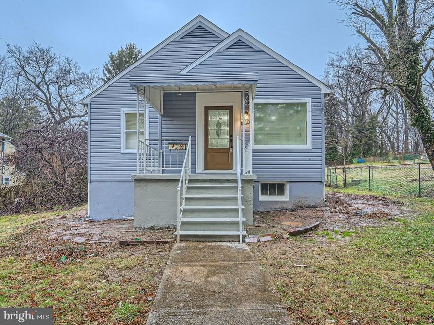 Beautifully remodeled 4BR/2BA cottage on a spacious lot in the quiet neighborhood of Cedmont in Baltimore city.  Walk up to the covered front porch and open the door into your forever home.  Welcoming you is an open concept main floor offering tons of natural light and beautiful luxury flooring. The spacious living room is open to the dining area that leads to a stunning kitchen. The kitchen boasts plenty of cabinets to the ceiling, stainless steel appliances including a slide in gas range with a glass and stainless range hood, a deep stainless sink under a window, and stunning quartz countertops with a complementing Glass tiled backsplash that continues to the ceiling. This floor contains two of four bedrooms, one a large primary, next a sizable secondary, and a full bath. The lower level gives you additional living space with a spacious family room, a full bath and the remaining two bedrooms featuring above grade windows. From the kitchen step outside to a covered patio that overlooks a large open yard with tons of green space and pull-up driveway off the back alleyway. This home is move-in ready with so much to offer new homeowners, and is within close proximity to shopping, restaurants, and commuter routes.