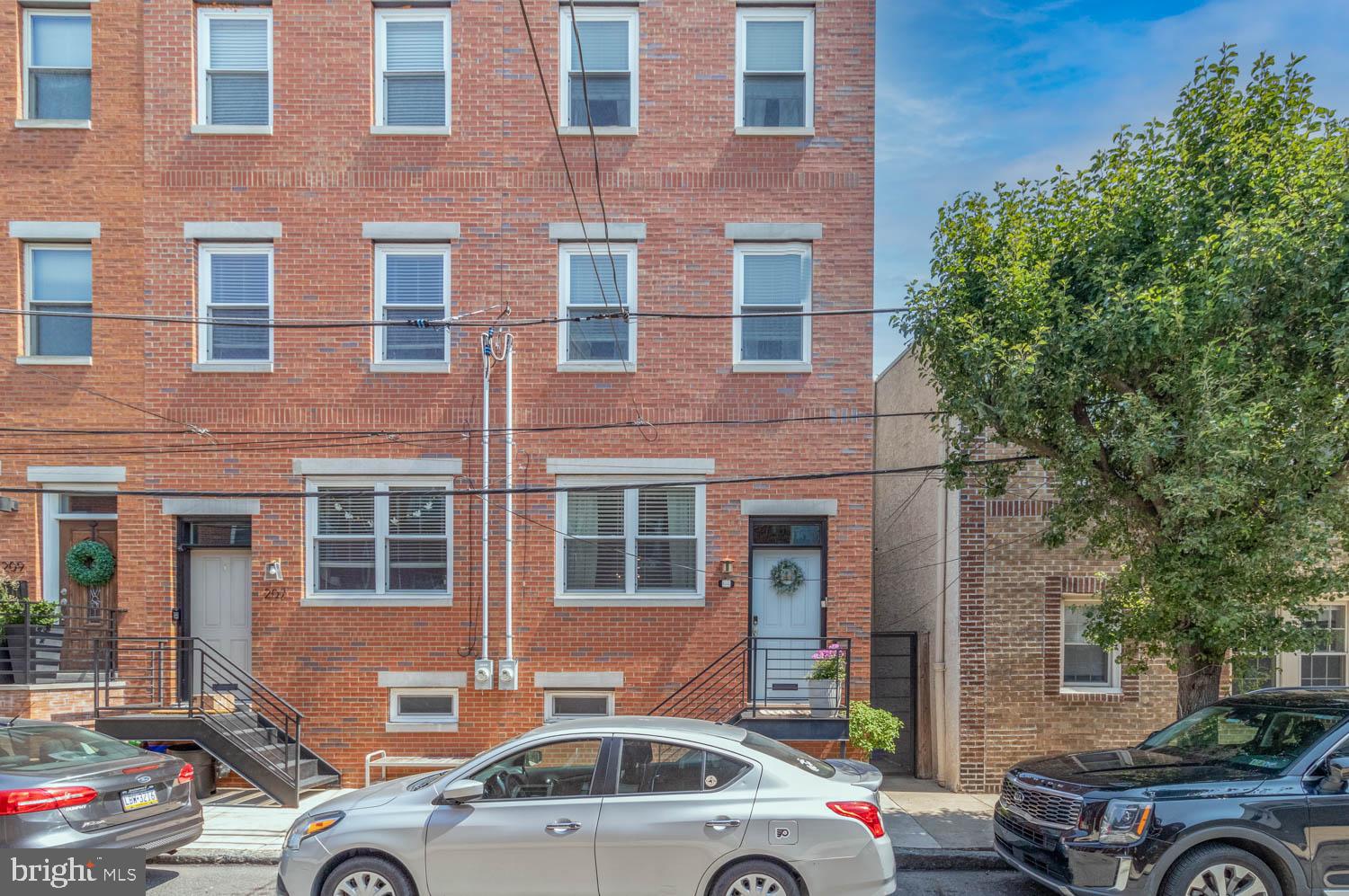 Welcome to your next home in Philly's very popular section of Pennsport!
Recently built in 2017, and located on a family-oriented block just off Dickinson Square, this home is move in ready with a modern design, and a lot of charm. This home has a ton of a natural light, an open floor concept, very high ceilings, and beautiful flooring. The kitchen is spacious, with a larqe countertop that holds plenty of room for seating, and leads into the backyard area perfect for rest/relaxation on a nice day. The backyard also has an alleyway that leads to the front of the house to make things easy on trash day!
The second floor has two very spacious bedrooms and also has great natural lighting. The full bath located off the hallway has a tub, and dual sinks. The third floor is where the large primary bedroom is located. The primary has a spacious walk-through closet, which leads to the second full bath which is large, spacious and has a beautiful stand in shower. The third floor also offers a wet bar in the hallway which leads to the roof deck that shows the beautiful views of Philly. Look south: you'll see the home of the Super Bowl Champs. Look Northeast, you'll see the Ben Franklin Bridge. Look Northwest, and you'll see a stunning view of the Center City skyline. You can't miss with these views!
Last but not least, the fully finished basement. The lower level is a versatile space, which includes a laundry area, a half bath, and a storage/mechanical room. This space can be used as a media room, home office, gym, or playroom— adaptable to meet your specific needs. Conveniently located near parks, shops, restaurants, transportation, and the waterfront, this home also includes a tax abatement with 2+ years remaining. Welcome to 205 Mountain Street!