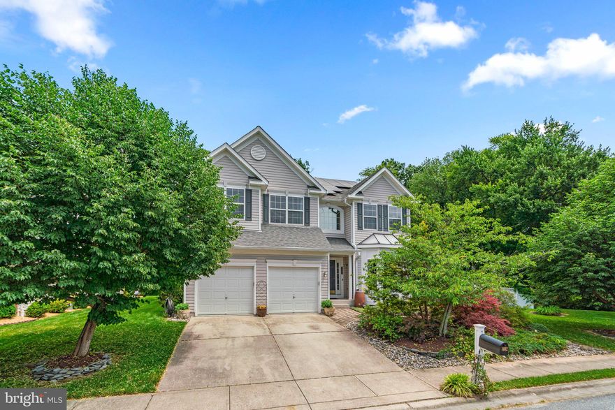 Welcome to your dream home! This detached single family home boasts over 3200 sq ft above ground, a 2 car garage and backs to serene trees for ultimate privacy. Step inside to find newly refinished hardwood floors throughout the main level, an expansive  kitchen with stainless steel appliances and island with a gas cooktop, a sunroom off the kitchen  and a 2 story family room perfect for gatherings.
Enjoy relaxing in the living room by the gas fireplace, hosting dinner parties in the dining room, and having the convenience of a mudroom and main level full bath. Upstairs, you'll find 3 spacious bedrooms including a luxurious primary bedroom and bathroom, as well as a 2nd full bath and upper level laundry. Don't miss all the customized closets throughout  the home. The unfinished lower level provides endless possibilities including a potential 4th bedroom and rough in for bathroom.
Outside, the low maintenance deck and fence provide the perfect space for outdoor entertaining, and an adjacent extra lot conveys with the property for added space and potential. Solar Panels convey and are owned by the sellers.
The location is conveniently located near vital transportation links like the Odenton MARC train station, Baltimore–Washington International Airport, and major road networks leading to Fort George G Meade, Baltimore, and the heart of Washington D.C. This connectivity makes it an ideal choice for commuters or anyone looking to explore the rich amenities of the region.