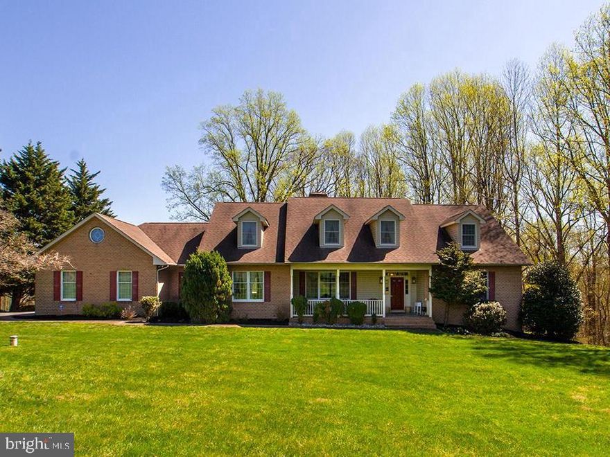 OPEN HOUSE for Sat. June 24th CANCELLED. Property under contract. Reduced $74K !!. Astounding views of Worthington Valley from this Glyndon property!! House built in 1997 on 3.37 acres. Situated on a dead-end private road. Traffic? Not a problem!! This 5 bedroom 2 full and 2 half bath house offers 3,800 SF of finely finished living space. Wood floors throughout the main floor. Two master bedrooms with an unique set-up sharing a large walk-in closet and bathroom. Kitchen is open to family room with wood-burning fireplace. A second fireplace adorns the formal living room. The formal dining room is HUGE!! An 8' sliding door off the family room accesses the 500 SF rear deck. Grill is directly connected to the owned underground propane tank (1,000 gal) An oversized 3-car garage is set up for side access. Bluestone walkway from paved drive to roofed bluestone front porch. The upper level bedrooms are spacious and the Cape Cod style house provides dormers in all of them There is a sitting room and separate quaint office in that upper level to add to bedrooms 3, 4 and 5.  There is a chair lift installed on the extra wide staircase from the main floor to second level. It can remain and convey with the sale if needed. Or, the seller is prepared to have it professionally removed prior to settlement. Verizon Fios serviced the property in the past for internet/TV/ and phone. Basement is unfinished and offers an additional 2,500 SF to add to the living space. There is a rough-in for a future bathroom. This property is nicely landscaped and has been carefully maintained by the seller who is the original owner. The seller has contracted for the front bluestone walkway to be repointed and that project is expected to be completed by 5/15/2023. Multiple heating and cooling zones. Basement is walk-out level and has full light windows providing lots of natural light. 9 foot ceilings....pocket doors.....rich appealing crown moldings and trim throughout this fine home. Propane heat provided by two separate furnaces. 1,000 gallon underground propane tank is owned and conveys with sale. Recently inspected.  The house is also equipped with a propane generator. 9 miles and 15 minutes from Hunt Valley and/or Towson.