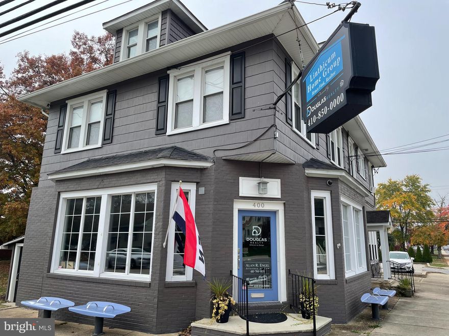 GREAT VISIBILITY. HIGH TRAFFIC COUNT. BEAUTIFUL, BRIGHT MAIN LEVEL SHARED OFFICE SPACE WITH CONFERENCE ROOM IN LINTHICUM LANDMARK BUILDING WITH 14 CAR PARKING LOT AND DRY BASEMENT STORAGE. 1-5 OPEN DESKS AVAILABLE FOR YOUR BUSINESS.  11' CEILINGS. 15' GRANITE BAR/WORK COUNTER. FULL KITCHEN WITH GRANITE COUNTERTOPS WITH FRIDGE, COFFEE MAKER, AND FILTERED WATER DISPENSER. HANDICAP ENTRANCE. FULL BATH WITH SHOWER. CEILING SPEAKERS THROUGHOUT. WELL MANICURED, USABLE SIDE YARD. YOUR BUSINESS MUST BE COMPATIBLE WITH DOUGLAS REALTY OPERATION.