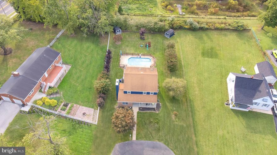 Looking for  a large, level lot with nearly a half an acre but in close proximity to shopping, dining, entertainment and outdoor recreation? Here it is! This home offers a floorplan with versatile space, an inviting  great room, warm family room with wood burning fireplace and a lovely dining room that flows into a beautiful corner kitchen. 
The front of the home is welcoming and stately with covered porch and circular drive. The main level includes an eat in kitchen with newer high end KitchenAid appliances and granite countertops. Recessed lighting has been added throughout the home as well as custom light fixtures. Laundry room is conveniently located on the main level as well. 
Upstairs, enjoy a spacious and luxurious owner's suite with soaking tub, separate glass shower and two walk in closets. All of the bedrooms are supersized with nice closets and ceiling fans for comfort. 
The outdoor space is an entertainer's dream and includes a large  deck that extends along the entire rear of the home with retractable awning, plus an inground pool with concrete decking, two storage sheds and lush level yard that expands to almost a half acre. What an awesome yard for play, sports, parties and privacy!
The lower level is mostly finished and also has some storage space with a walk up to the back yard. 
Neutral paint, crown molding, newer hardwood floors and carpet throughout.
There is also a whole house fan. 
The other good new is NO HOA. This  amazing location just minutes to major arteries of travel, shopping, dining and local areas of interest.