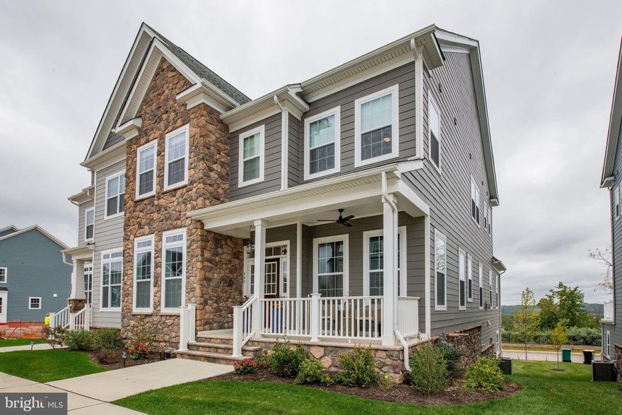 Nestled in the exclusive Spring Oak community, this luxuriously out-fitted Carriage home is a masterpiece of bespoke design and quiet elegance with meticulous designer upgrades. Perched atop the highest ridge of the neighborhood, this home overlooks one of the most picturesque valleys in all of Malvern.

From the moment you enter, the grand scale of the first floor layout offers a generous, spacious and yet warm and welcoming space , with 10′ ceiling heights, exquisite hardwood floors, and even an Office/Library/Guest Suite with a Full Bath.
The open-concept, epicurean-worthy Kitchen features a large Calacatta Miraggio island, surrounded by commercial-grade stainless steel appliances, leathered granite countertops, upgraded designer cabinets with extensive lighting, all perfect for entertaining.
The meticulous attention shown to the Kitchen sets the scene for a seamless transition into the heart of the first level with the Great Room and Dining Room, framed with oversized windows that give unparalleled, unobstructed views of the Malvern valley.
 A front room, reminiscent of a traditional Parlor, or Music Room, connects from the Great Room by way of a handsomely-fitted, decidedly-posh Butler’s Pantry.  Fine touches like the peacock glazed tile backsplash, a hammered copper custom sink, under counter ice-maker, wine cooler and more will make this a conversation starter as much as a delight for entertaining!

Upstairs, the Owner’s Suite beckons as a welome respite, with a generous walk-in custom closet, spa-like en suite accommodations, including separate vanities, a water closet, and a large glass stall shower.
Additionally, two separate en suite Bedrooms, each with a walk-in closet, provide ample comfort and privacy for family members or guests alike. 

Accessed from the street behind the home through a spacious Garage is the finished Basement - comprised of a custom in-home theater, along with all the necessary plumbing in place for a future full Bathroom, and an additional Bedroom that can double as an Office.