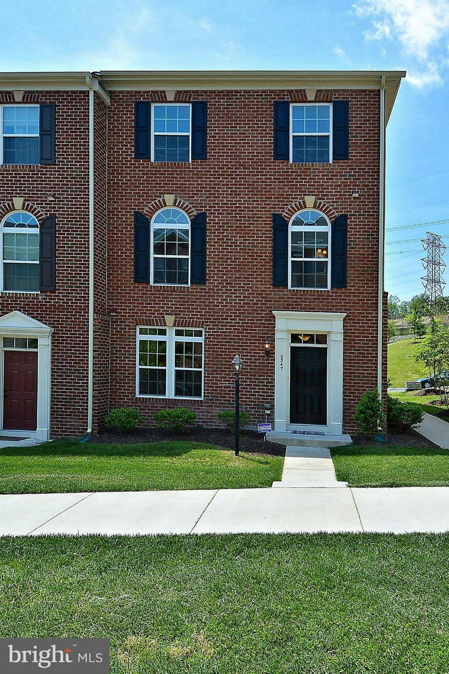 Spacious Brick End Unit Townhome in popular Potomac Club! Upgrades include: tiled bathrooms, wood floors, front load washer/dryer, recessed lights thru out...the list goes on! Sunny 20x10 deck backs to common area.Large 2 car garage w/ extra storage.Luxurious clubhouse amenities! Walk to Wegmans & Stonebridge shops & restaurants!