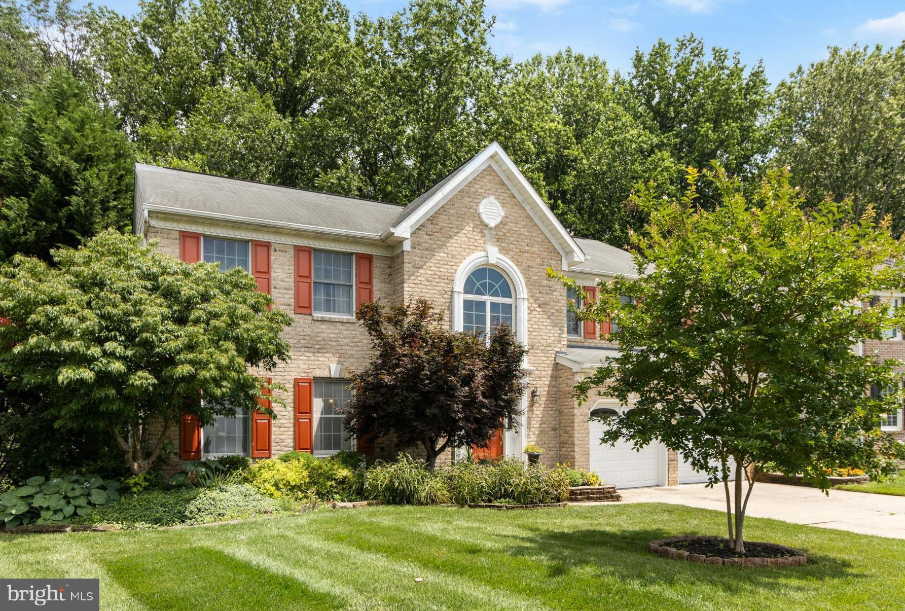SIMPLY WONDERFUL! Move right into this stunning, impeccably maintained 5-bedroom colonial, located in the sought-after Patterson Mill School district. Impressive 2-story foyer features gleaming hardwood floors and a dramatic atrium window that fills the space with natural light. The formal living and dining rooms boast hardwood floors, elegant crown moldings, and classic chair rails. The gourmet kitchen is a chef’s dream with a center island, ceramic tile flooring and backsplash, recessed lighting, and a spacious breakfast area that opens to a large deck. Just off the kitchen, the sunken family room offers a cozy gas fireplace, perfect for relaxing evenings. Upstairs, you’ll find brand-new carpeting, a generous landing area, and a convenient upper-level laundry room. The expansive primary suite features a cathedral ceiling, walk-in closet, and a luxurious en-suite bath with a garden tub, separate shower, and dual vanities. The fully finished lower level includes in-law quarters with a bedroom, full bath, a service bar with microwave, and a versatile living area with a fold-down counter and walk-out access to the rear patio. A huge storage room with built-in shelving provides plenty of extra space. Enjoy ample parking with a 2-car garage and extended driveway. Nestled on a premium, private, professionally landscaped lot backing to mature trees—this home is a Nature Lover’s Paradise. *** A TRULY EXCEPTIONAL HOME! ***