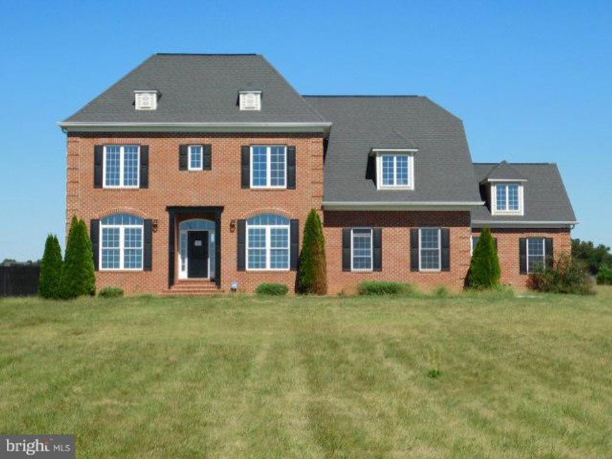 High end all brick home with mountain views and lots of space. Cathedral ceiling, large rooms, red oak stained floors grand staircase and an open flow. Gourmet kitchen, great appliances, mezzanine, certified energy effic. Two masters, one on main, Basement is framed in and already has electrics in place. Great 2.9 acres w/ outstanding patio and outdoor kitchen area. Four car attached garage