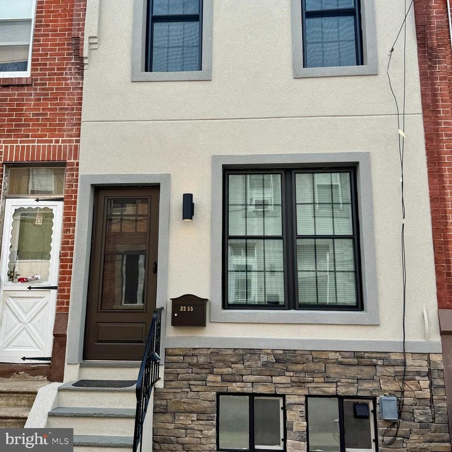 Welcome to this stunning, newly and fully renovated 2-bedroom townhome in the highly sought-after Port Richmond neighborhood. This home has been thoughtfully designed with modern finishes and impeccable attention to detail, offering style and functionality. Step inside to an open floor plan that creates a bright and airy atmosphere, perfect for entertaining or simply relaxing. The spacious living area flows seamlessly into the contemporary kitchen, featuring sleek cabinetry, modern countertops, and stainless steel appliances. The home boasts brand-new windows that flood each room with natural light, enhancing the warm and inviting ambiance. Upstairs, you'll find two generously sized bedrooms with ample closet space, complemented by a beautifully updated modern bathroom designed for comfort and luxury. Throughout the home, brand-new flooring, and doors add to the fresh, contemporary feel.  Updated electric, plumbing, and roof 5 years old. Finished basement for additional living space. Enjoy year-round comfort with a brand-new HVAC system and water heater, ensuring energy efficiency and peace of mind. Outside, escape to your private backyard oasis, complete with a brand-new deck—perfect for morning coffee, evening gatherings, or unwinding in your own outdoor retreat. This move-in-ready home truly has it all—modern upgrades, a prime location, and a cozy yet stylish atmosphere. Don't miss the opportunity to make this gem in Port Richmond your own!