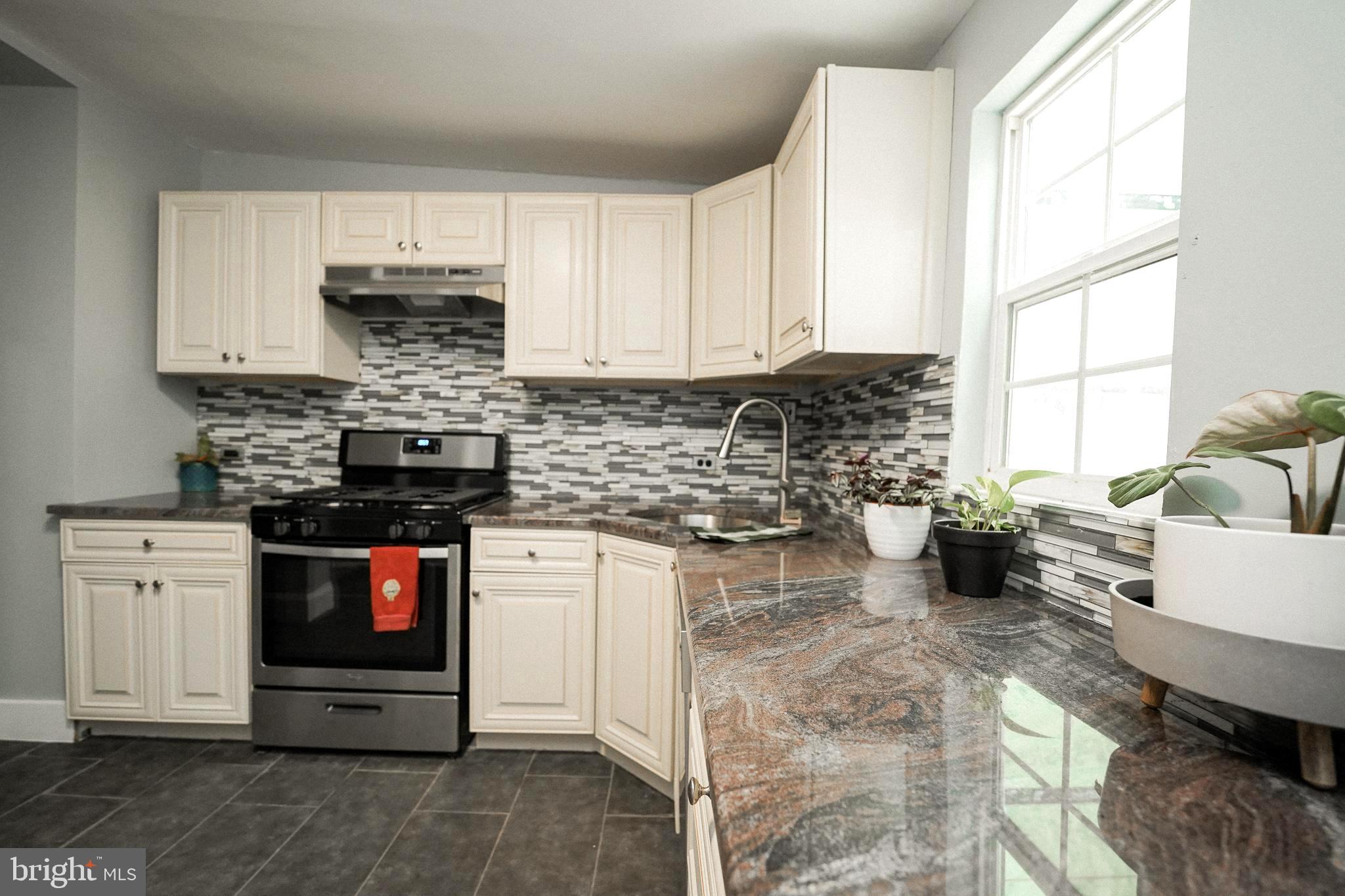 This newly renovated and affordable 2-bedroom home is ideally located just steps from Frankford Avenue and all the neighborhood favorites. The first floor features exposed brick accents, premium flooring, and a stunning open-concept kitchen with custom solid wood cabinetry, new stainless steel appliances, granite countertops, and a sleek glass tile backsplash. Upstairs, you’ll find two comfortable bedrooms with brand-new carpeting and ceiling fans. The beautifully updated bathroom is outfitted with slate tile and all new fixtures.
Enjoy the added bonus of a clean, dry basement with fresh paint, a new HVAC system, and laundry area. Just a short walk to Pop's Dog Park, Philadelphia Brewing Company, Kensington Co-op, SEPTA, and an array of cafes, restaurants, and bars. Only a block from the Market-Frankford Line for a quick ride to Center City and 30th Street Station.
With new restaurants, commercial spaces, and artist studios under construction nearby, now is the perfect time to buy into this rapidly developing neighborhood!