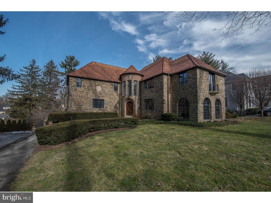 The elegance and charm of a french country estate with all the modern facilities  such as an ultra modern kitchen/family room with wolf range, quartz counter tops,sub zero and wine refrigerators.   The main floor consists of a stone floor foyer, huge living room with antique stone gas fireplace; a den/office, an enclosed sunroom, a large dining room, a powder room, and a laundry room.  The second floor consists of the master suite with a Juliette balcony off its sitting room and master bath, 5 other bedrooms and 3 baths.  The 3rd floor is a finished attic transformed into a media/game room with lots of storage, including a cedar closet,and an hidden room.  The basement has been completely remade into a Moorish cabaret with its huge bar, wine cellar as well as a full bath and sauna.  It opens into a patio leading to the L-shape swimming pool.  Hardwood floors throughout and all new windows.  This home has been lovingly cared for by its owners and is move-in ready.