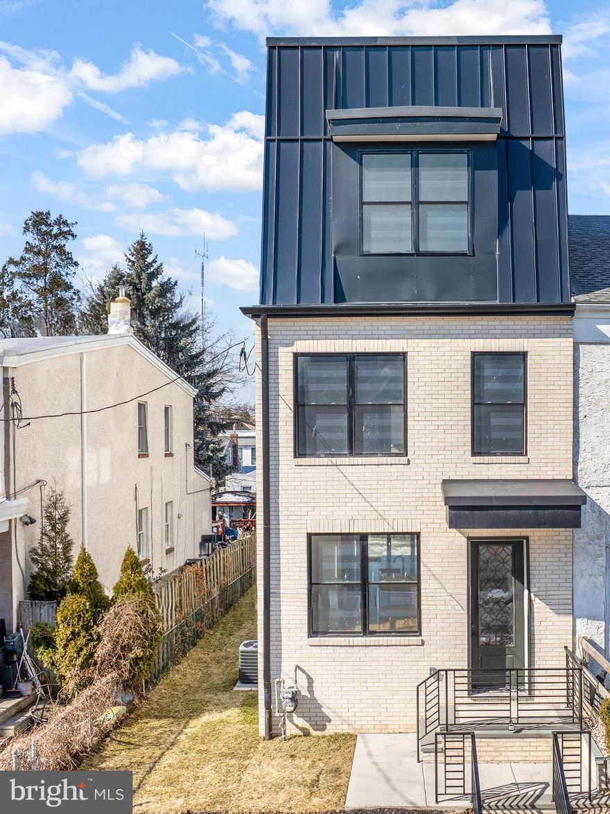 Stunning New Construction in Manayunk – 4 Bedrooms | 3.5 Baths | 3-Car Parking. Welcome to this beautifully crafted new home in the heart of Manayunk, offering four bedrooms, three-and-a-half baths,  three private parking spaces, and a 752 sq ft rooftop deck. The FIRST FLOOR features a bright, open-concept layout with a spacious living room, gourmet kitchen, powder room, and family room with a gas fireplace. Sliding doors lead directly to the rear parking area for added convenience. The kitchen is thoughtfully designed with a center island, quartz countertops, and stainless steel appliances—perfect for both everyday living and entertaining. The SECOND FLOOR is home to an impressive primary suite complete with a generous bedroom, separate his-and-hers closets, and a luxurious en-suite bath featuring a walk-in shower with multiple shower heads, a deep soaking jetted tub, and a double vanity. The THIRD FLOOR offers two additional bedrooms, a full hall bath with double vanity and walk-in shower, plus a conveniently located laundry area. Enjoy sweeping views from the ROOFTOP DECK, an ideal space for relaxing or hosting gatherings. The LOWER LEVEL provides exceptional bonus space, including a steam room, sitting/flex room, fourth bedroom, and a full bath with walk-in shower—perfect for guests or extended living. Additional highlights include: Two brand-new gas HVAC systems, Solid hickory hardwood flooring throughout,  Luxury vinyl plank flooring in the lower level, Three private parking spaces. Ideally situated in Manayunk, this home offers easy access to the Tow Path and Schuylkill River Trail, along with nearby restaurants, shopping, and public transportation. A rare opportunity to own a thoughtfully designed home in one of Philadelphia’s most vibrant neighborhoods. Best Feature is that the home offers a TEN TEAR TAX ABATEMENT.