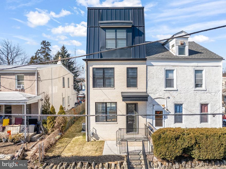 Stunning New Construction in Manayunk – 4 Bedrooms | 3.5 Baths | 3-Car Parking. Welcome to this beautifully crafted new home in the heart of Manayunk, offering four bedrooms, three-and-a-half baths,  three private parking spaces, and a 752 sq ft rooftop deck. The FIRST FLOOR features a bright, open-concept layout with a spacious living room, gourmet kitchen, powder room, and family room with a gas fireplace. Sliding doors lead directly to the rear parking area for added convenience. The kitchen is thoughtfully designed with a center island, quartz countertops, and stainless steel appliances—perfect for both everyday living and entertaining. The SECOND FLOOR is home to an impressive primary suite complete with a generous bedroom, separate his-and-hers closets, and a luxurious en-suite bath featuring a walk-in shower with multiple shower heads, a deep soaking jetted tub, and a double vanity. The THIRD FLOOR offers two additional bedrooms, a full hall bath with double vanity and walk-in shower, plus a conveniently located laundry area. Enjoy sweeping views from the ROOFTOP DECK, an ideal space for relaxing or hosting gatherings. The LOWER LEVEL provides exceptional bonus space, including a steam room, sitting/flex room, fourth bedroom, and a full bath with walk-in shower—perfect for guests or extended living. Additional highlights include: Two brand-new gas HVAC systems, Solid hickory hardwood flooring throughout,  Luxury vinyl plank flooring in the lower level, Three private parking spaces. Ideally situated in Manayunk, this home offers easy access to the Tow Path and Schuylkill River Trail, along with nearby restaurants, shopping, and public transportation. A rare opportunity to own a thoughtfully designed home in one of Philadelphia’s most vibrant neighborhoods. Best Feature is that the home offers a TEN TEAR TAX ABATEMENT.