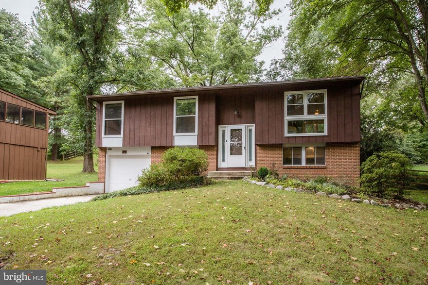 Welcome to 9461 Pinecone Row! Located on a quiet cul-de-sac in the coveted Village of Oakland Mills this home sits on a .26 acre lot boasting 3 bedrooms, 2.5 bathrooms, a patio, and a single car garage. Walking to the main floor you will be greeted by a light filled open concept kitchen, living room, and dining room. Gorgeous luxury vinyl plank is featured throughout the entire floor which perfectly accents the ceiling’s natural wood beams. The kitchen shows stainless steel appliances, updated marble countertops, updated backsplash, and a perfectly sized peninsula. The rear of the dining room provides access to the homes patio and fully fenced in yard. Taking a step back inside you will walk down the hallway towards the two main floor bedrooms. A full bathroom will greet you on the right. Just past the bathroom, you will observe the first bedroom on your left. The bedroom’s oversized window provides tons of natural light throughout the room. The primary bedroom is located at the end of the hallway and is extremely large. It features two closets, a sitting room, and an updated primary bathroom which is made complete by beautiful tile shower. Continuing down to the lower level you will be greeted by another large living space that is perfect for a second living room, Lounge, or kids play space. This space features a brick accent wall and tile flooring. The floor also shows another large bedroom, half bathroom, and access to the single car garage! 9461 Pinecone Row  is ready for its new owner and won’t last long! Schedule your showing today!