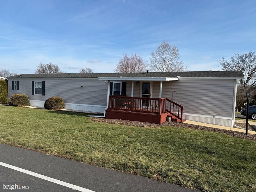 Nicely cared for and well maintained one owner home on well manicured corner lot! Interior features an open floor plan with  cathedral ceiling, kitchen with central island/double sink/breakfast bar, and living room. Spacious primary bedroom  features an adjoining  primary bath and  a walk in closet. Replacement windows! Exterior features a covered deck in front and a relaxing rear patio with privacy. Refrigerator, washer & dryer, and microwave are included.  Utility shed. 2 off street parking spaces. Very nice home! Flexible possession.  EZ to show!