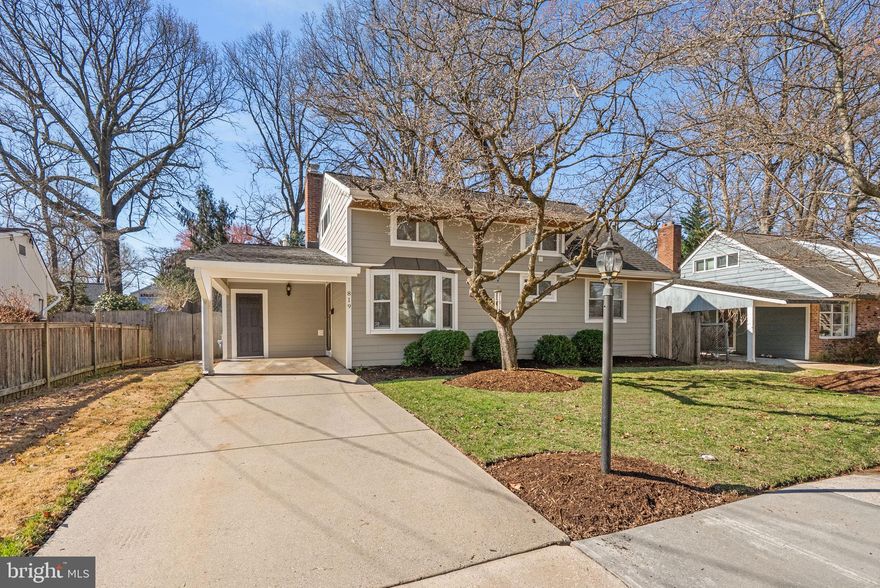 COMING SOON!! This one is special. Nestled on a tranquil, tree-lined street in one of Rockville’s most coveted pockets, this 4-bedroom, 2-bath residence is a masterclass in organic modern living. From the moment you pull into the driveway and under the sheltered carport, the home’s elite curb presence is undeniable, framed by mature oaks and refined architectural wood trim throughout, that provides a warm, bespoke welcome with a touch of class. The heart of the home is an expertly updated kitchen featuring rich custom cabinetry, granite countertops, and a suite of stainless steel appliances, including a stylish oven and hood vent that overlooks the show-stopping back yard . In a rare and thoughtful layout shift, the kitchen flows seamlessly into a sun-drenched main living area where massive windows act as a living gallery, flooding the space with natural light and offering panoramic views of your private backyard oasis. Hardwood floors and designer recessed lighting run throughout, culminating in a living room anchored by a sophisticated stone-accent fireplace. Step outside onto the oversized composite deck and enjoy a backyard from which dreams are made! A true sanctuary featuring a majestic oak tree that provides a natural canopy of shade—perfect for birdwatching the local cardinals and blue jays—while a full privacy fence ensures total seclusion. Exceptional secondary features include a whole-home generator for absolute peace of mind and an architectural stunner of a shed situated on a permanent concrete slab with custom shelving and matching wood trim accents. This home offers the luxury of a quiet, walkable neighborhood just minutes from the vibrant restaurants, farmers' markets, and Metro access of Rockville Town Center. Perfectly situated within the top-rated Julius West Middle and Richard Montgomery High school clusters, this property is more than a home; it is an indispensable asset to your lifestyle.