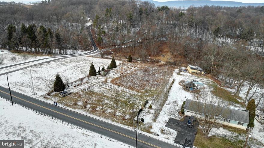 Beautiful quiet location with lots of wildlife and beautiful mountain views on this 1.57 acre
lot with several valuable improvements already done including a working well on site,
200 amp electrical service, driveway permit on file and 2 approved perk sites for on site
sewage systems. This lot is located in Wayne Township, Dauphin County in the Halifax
area school district . This lot has a slight slope for a possible walk-out lower level
and backs up to a wooded area and a small stream with buried 3’ pipe which the
water underground and creates a land bridge to access the back of the property.
The lot has some fruit trees on site. The garage currently on site does not convey
at this price and the seller will move prior to closing. This is a quiet serene location
just a few minutes drive to Harrisburg and Appalachian trail is close by.