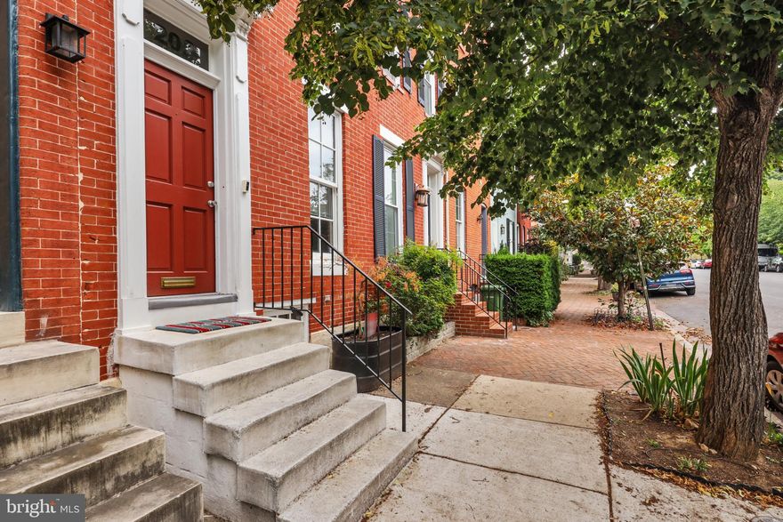 Amazing opportunity to own a beautiful 2-bedroom, 1.5 bathroom home with modern features and original charm. Live on THE best block in Federal Hill. One block from Federal Hill Park with amazing views of the inner harbor from the BRAND-NEW roof top deck. Features include a functional wood burning fireplace, original wood floors throughout and curved mahogany staircase, pocket doors in the upstairs full luxury bathroom WITH heated floors, freshly painted throughout, BRAND NEW kitchen appliances, original doorknobs and so much more. This charming home offers wonderful amenities at a great price in a PRIME LOCATION.