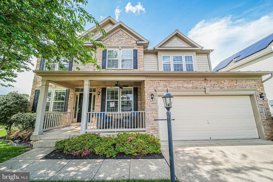 On the corner of two quiet streets in the amazing suburban community of Hope Hill Crossing sits your new home. This handsome stone-front property has so many living spaces you'll be hard pressed to use them all! Enter through your two-story foyer to an open-concept main level with gleaming hardwood throughout. The heart of your home is a gourmet kitchen to die for, with plenty of room for multiple cooks plus counter seating for *eight* around the island and raised bar -- you can chat with your guests as you cook. Talk about primo entertaining space! Other highlights of this huge kitchen are more counter space, drawers and cabinets then you could ever fill, double ovens, a gourmet gas range and an expansive corner pantry. Wow! Elsewhere, an extension off the kitchen offers a light drenched sunroom with backyard access (or you could use it as a breakfast room). Rounding out this level is a large family room with gas fireplace, an open dining area, and a separate office space. Finally, a prior owner turned the former living room into a main-level bedroom with a full bath. That bath features a roll-in shower and grab bars, and will accommodate anyone with mobility challenges, while a ramp in the garage will allow them roll-up access to the main level. *In-law suite anyone*? Heading upstairs we find three generous bedrooms with large closets, a *bedroom-level laundry room* and a shared hall bath (with a door separating shower & toilet from the double-sink). But the best part of this level is your primary bedroom suite/oasis: an oversized bedroom area with plenty of dresser space is complemented by a spa-like bath with jetted soaking tub, double sinks and separate toilet area. The closet is highly customized. A large adjacent sitting room features a gas fireplace and lounging area for your morning coffee or late night movies. So private...why would you ever leave this suite? On the lower level of your home, the fully finished basement does not feel choppy even though it features a bedroom (w/ egress window well) and full bath, a media room, and a rubber-floored exercise room with mirrors and ballet barres, plus two storage rooms. In the main recreation area you will find a large granite topped bar and plenty of room for family game night, ping pong, and lounging about. Or evening cocktails....Outside your home, the spaces are just as thoughtfully laid out: in the fenced backyard is a large stamped concrete patio with multiple zones, plus an 8x12 shed. In front -- and since Hope Hill is such a walkable and dog-friendly neighborhood -- you will enjoy waving to passersby from your covered front porch. *Don't sleep on the amazing amenities that Hope Hill provides, its proximity to everything retail/recreation/transportation, and the highly rated school pack*. Come check out our beautifully maintained property, make us an offer, and make this your new home!