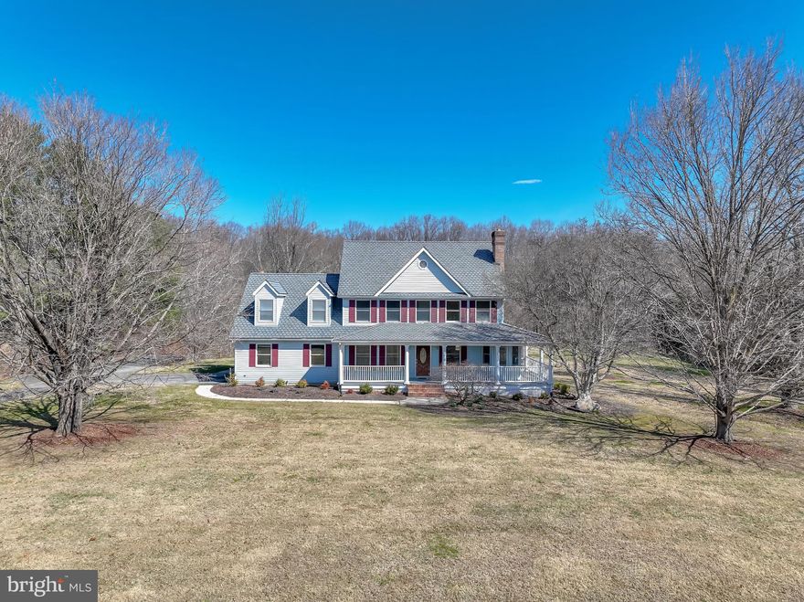 Situated in the desirable Reservoir Ridge community, this impressive four-bedroom colonial with two full and two half baths sits on a remarkable four-acre property that backs directly to Liberty Reservoir Watershed land, offering exceptional privacy and a true nature lover’s setting. From your backyard you can explore miles of fire trails perfect for hiking, horseback riding, and outdoor adventure, with frequent sightings of deer, wild turkeys, and even bald eagles. The peaceful surroundings can be enjoyed from the wraparound porch, screened porch, or large rear deck overlooking the wooded landscape.
The interior has been freshly updated with new carpeting, luxury vinyl plank flooring, refinished hardwood floors, and fresh paint throughout, creating a clean and move-in-ready space.
The main level features a functional and open layout designed for both everyday living and entertaining. The family room includes a gas fireplace, custom built-in shelving, a 60-inch ceiling fan, and direct access to the expansive low-maintenance deck. Adjacent to the family room is the dinette and kitchen area, complete with brand-new stainless steel appliances and plenty of opportunity to customize to your style. This level also includes formal living and dining spaces featuring a wood-burning fireplace, a private office with built-in shelving, and a convenient half bath.
Upstairs, the primary suite offers a private retreat with a beautifully renovated bathroom featuring a walk-in shower, soaking tub, dual vanity, and separate dressing room. Three additional bedrooms and another full bath provide comfortable space for family or guests.
The walkout lower level offers extensive additional living space with vinyl plank flooring, recessed lighting, and sliding door access to the recently landscaped backyard. A fully updated half bath is already in place, along with rough-ins for a wet bar and gas fireplace, making the space ideal for a future recreation room or entertainment area.
The side-entry two-car garage includes built-in storage cabinets, a workbench, and a built-in tool chest, providing excellent workspace and organization. The property also features a large 20' x 40' parking pad suitable for an RV, boat, trailer, or additional vehicles.
With four acres backing to protected Liberty Reservoir property, this home offers rare access to nature and room to roam, you can literally step outside and hike for miles from your own land.
Conveniently located near Liberty Reservoir Boat Launch, Eldersburg’s shops and restaurants, and major commuter routes into Baltimore, this property offers a unique combination of space, scenery, and accessibility.