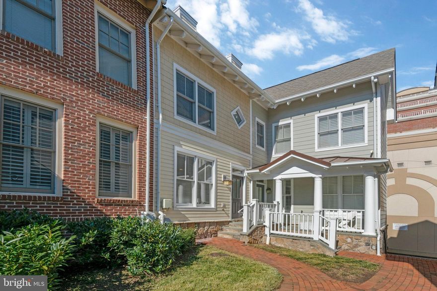 Bright, airy and freshly painted, this cheerful 4-level townhome is just 2 blocks to the metro, in super convenient Clarendon Center, with parks, restaurants and shops nearby! The open floorplan, with hardwood floors throughout, and a light-filled, eat-in  kitchen with center island, stainless steel appliances and direct access to a large deck. The upper level offers two bedrooms with en-suite bathrooms, and the top level offers a versatile loft - perfect as a third bedroom for guests or family, or as a home office or playroom, with access to a rooftop patio! The lower level features a den with a gas fireplace, full-size washer/dryer and access to the one-car garage. Available now with flexible lease terms!