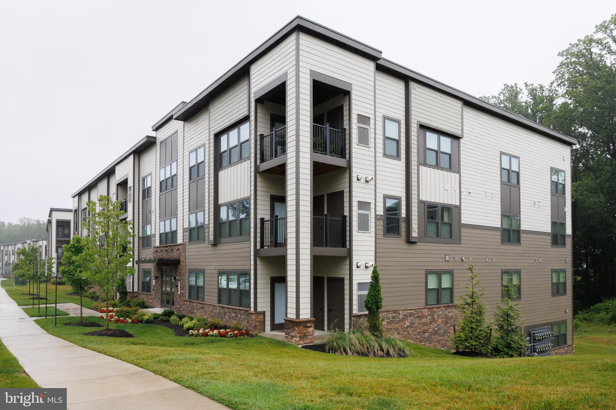 Welcome to this rarely available Sapphire model in Ravenwood of Turf Valley—the largest and most spacious floorplan offered in the community. Featuring 2 bedrooms and a versatile den, perfect for a home office or bonus room, this stunning condo offers exceptional living space and thoughtful upgrades throughout. Enjoy privacy and elegant style with top-down bottom-up cordless honeycomb shades on all windows, enhanced by custom fabric panels and a custom cornice in the den. The home has been freshly painted throughout, including walls, ceilings, doors, and trim, creating a clean and modern feel. The primary suite boasts customized closets and an upgraded en-suite bath with comfort-height cabinetry and a cultured marble countertop. The guest bath also features upgraded finishes for a cohesive, upscale look. A custom-shelved laundry closet adds practical storage, while a smart lock on the front door ensures convenience and peace of mind. Located in the sought-after Turf Valley community, just moments from golf, dining, shopping, and top-rated schools—this move-in-ready home is an exceptional opportunity for spacious, stylish living.Schedule your showing today!