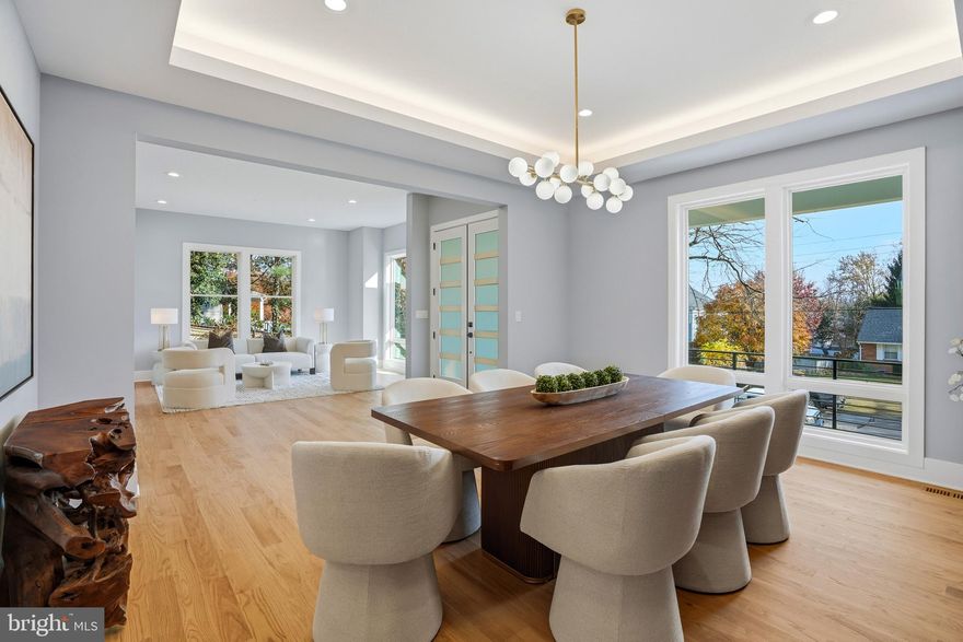 Welcome to 7306 Sportsman Dr, a brand-new 2025 custom home by YR Design & Build offering over 7,300 square feet of finished living space across three levels in the heart of Falls Church. This six-bedroom, seven full and one half bath residence showcases refined modern architecture, wide-plank hardwood flooring, soaring ceilings, oversized windows, and thoughtfully curated custom finishes throughout.

The main level features an open-concept floor plan designed for both everyday living and entertaining. The gourmet chef’s kitchen is equipped with a waterfall quartz island, professional-grade Thermador appliances including gas cooktop and double wall ovens, custom cabinetry, walk-in pantry, and a sun-filled breakfast area. The spacious family room with fireplace flows seamlessly into the formal dining room. A private main-level bedroom suite with full bath offers flexibility for guests, in-law living, or multi-generational needs.
Upstairs, the expansive owner’s suite includes a sitting area, oversized walk-in closet, and a spa-inspired bath with soaking tub, dual vanities, and luxury shower. Three additional en-suite bedrooms and a central loft provide comfortable and functional living space.

The fully finished walk-out lower level is designed for entertainment and lifestyle flexibility, featuring a dedicated home theater, fitness room with professional rubber flooring, a large recreation room, an additional bedroom suite ideal for an au-pair or extended guests, and generous storage space.

Built with future-forward infrastructure, the home includes 400 AMP electrical service, energy-efficient Carrier dual-zone HVAC systems, and a high-efficiency tankless water heater. Additional highlights include new construction (2025), attached garage, modern open layout, walk-out basement, and energy-efficient systems.

Located within the Fairfax County Public Schools district and assigned to Westgate Elementary School, Kilmer Middle School, and the highly sought-after Marshall High School, this home offers convenient access to Tysons Corner, I-495, I-66, Route 7, and the Silver Line Metro, as well as premier shopping, dining, and major commuter routes, combining luxury living with exceptional convenience.