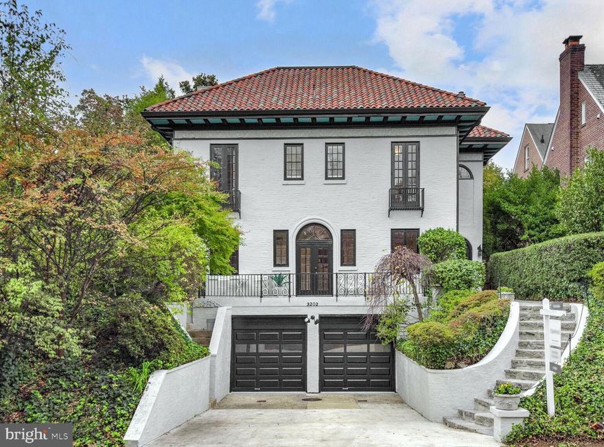 Rarely available Mediterranean-style home in sought-after Massachusetts Avenue Heights with striking curb appeal! 4,200+ sqft of beautifully finished living space. Hardwood floors and exquisite finishes across four levels. The main level has a modern kitchen with Subzero and Wolf that is open to a cute breakfast room. The double living room with wood burning fireplace and three sets of French doors opens to a large patio and a professionally landscaped rear garden, a large dining room opens to the elevated front patio and is perfect for formal entertaining, a powder room completes the main level. The second level has a spacious primary suite, walk in closet and large beautiful bath with elevated soaking tub, separate shower, double vanity and bidet. There are two additional bedrooms, one full bath, laundry room and a reading nook. The top level has two bedrooms, full bath and a cozy den with built-ins and extra storage. The lower level has a recreation room with newly renovated full bath, spacious two-car garage with storage. The home is filled with natural light and is excellent for seamless indoor/outdoor entertaining.