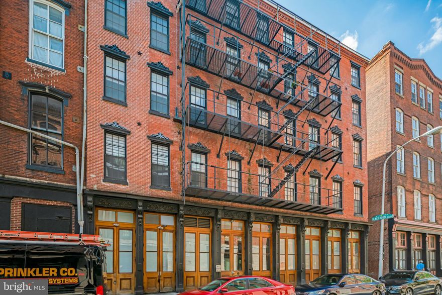 Unit 4F at Waterbridge Condominiums is just one of 25 residential units in the boutique building, boasting 2 bedrooms, 2 bathrooms, multiple exposures and a completely open floor plan!
4F is one of just 2 units that share and are situated on a PRIVATE BALCONY to gain entry, for a truly luxurious experience.  Once one enters the unit through the private balcony, they are greeted by tall ceilings, Brazilian Cherry hardwood floors running through the periphery of the unit, designer lighting package, and plenty of ample natural sunlight in addition to that.  The unit receives sun at any time of day due to its trifecta of window exposures; Southern, Eastern and Northern!
As you walk through the foyer, the layout is truly one that makes sense.  Both bedrooms are accessed from the hallway, whereas the master bedroom has its own private en-suite bathroom.  The secondary bathroom is its own standalone bathroom also accessed by hallway, so it's convenient for guests and company.  The entire length of the hallway has closets on the Western wall (3 of them!), so there is ample storage.  If that's not enough, this unit conveys with one STORAGE UNIT, located in the building!
The kitchen of 4F is an entertainer's dream, featuring full VIKING professional appliance package in stainless steel, 42'' cabinets, large central island adorned by pendant lighting, granite counters and glass subway mosaic tile backsplash.  The living room is adjacent to the kitchen, and both the kitchen and living room share a real gas fireplace with custom river rock stack stone, extending floor to ceiling.  This area has a built in SURROUND SOUND system!
The master bedroom of 4F features a large walk-in closet with plenty of built ins and has a private en-suite bath.  This master bathroom is a 3 piece, featuring beautiful glass basin DOUBLE sinks, JACUZZI tub, FULL BODY SHOWER, and HEATED FLOORS!  There is even a reach-in linen closet in the master bathroom, that extends nearly to the ceiling.  This bathroom is done in white subway tile, with tasteful glass mosaics, 3 built in mirrors (one of which is body length) and a 4-light sconce.
The secondary bathroom also has a glass basin sink, is done in white subway tile with glass mosaic designs.
The facade of Waterbridge Condominiums boasts beautiful historic details, such as hand carved scrolling, and wood walls, while pairing this with oversized Crystal drum chandeliers; it's truly a perfect marriage of high-end history meets today's luxury.  Amenities include, but are not limited to, ROOF DECK, COURTYARD with 50-foot mosaic waterfall, GYM, and there is parking right across the street!