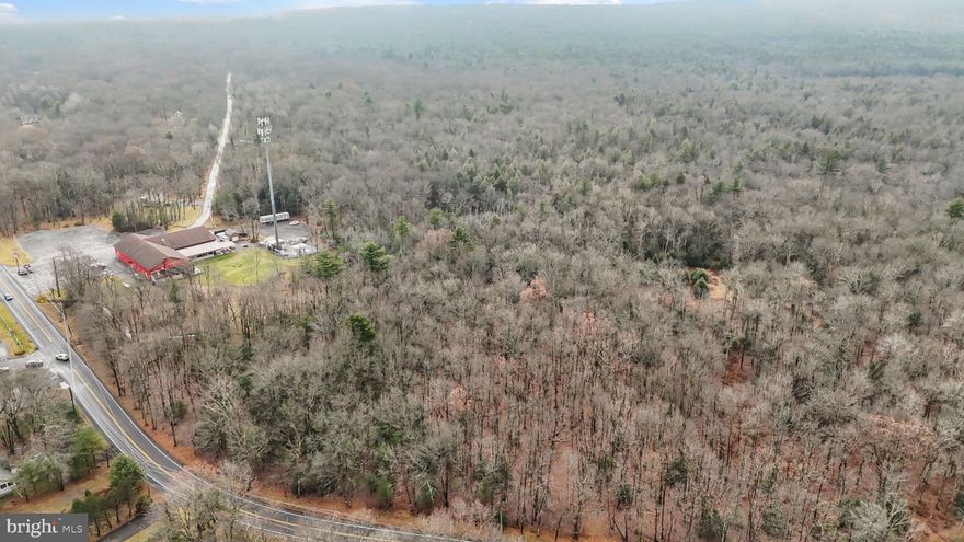 Welcome to a rare stretch of land where the Pocono landscape opens wide and invites your imagination to take the wheel. This expansive 37.275-acre parcel offers exceptional privacy, gentle terrain, and an abundance of natural beauty—perfect for building your dream retreat, creating a private compound, or exploring future development opportunities both residential and commercially zoned.  Located in the heart of Albrightsville, this property keeps you close to the best of the Poconos: hiking trails, lakes, ski resorts, state parks, and charming local spots that feel like hidden postcards. Whether you envision tucked-away cabins, wide-angle mountain living, or a peaceful escape wrapped in evergreens, this land gives you room to breathe and room to dream. With its generous size, convenient access, and endless potential, this is a standout opportunity for investors, builders, and anyone seeking a legacy piece of property in a fast-growing destination. Conveniently positioned near major Pocono routes, including 903, 534, I-80, and the PA Turnpike, allowing easy access to all area amenities.  Please check with local township and municipalities for all possible uses.. “Lot lines outlined in red are for illustrative purposes only and may not accurately represent the exact property boundaries.”