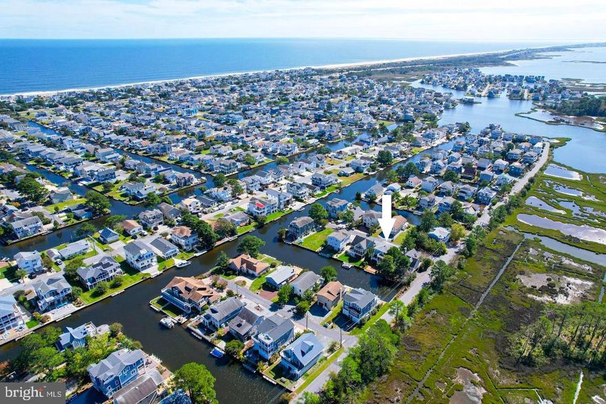 Stunning canal front retreat with a private boat dock and just a few blocks from the pristine life-guarded beach of South Bethany. This coastal gem offers the perfect blend of indoor and outdoor living, featuring an open floor plan with an inviting great room that flows seamlessly onto a spacious screened porch and sun deck overlooking the water—ideal for entertaining or relaxing by the canal.  At the heart of the home, the gourmet kitchen showcases high-end cabinetry, granite countertops and backsplash, a large center island, and premium stainless-steel appliances, creating the perfect setting for casual dining or elegant entertaining. The main level also includes a beautifully appointed guest bedroom and a full bath with a walk-in shower, all set against the warmth of Brazilian cherry hardwood flooring.  Upstairs, the private primary suite offers a serene escape with its own private deck with canal views, a spa-like bathroom with a glass-enclosed tiled shower, soaking tub, dual vanities, and a generous walk-in closet. Two additional guest bedrooms and another full bath with dual sinks and walk-in shower complete the upper level.  The ground floor includes a welcoming foyer, large storage/utility room, a convenient outside shower and covered parking.  An expansive waterfront deck extends to the water’s edge, offering the perfect spot for lounging, launching your kayak, or preparing for a day on the boat. Located in the sought-after community of South Bethany—known for its life-guarded beach and proximity to downtown Bethany’s boutique shops, restaurants, and boardwalk—this home offers the ultimate coastal lifestyle. Walk to the beach or take your boat, jet ski, or kayak out for a day on the water, all from your own backyard.