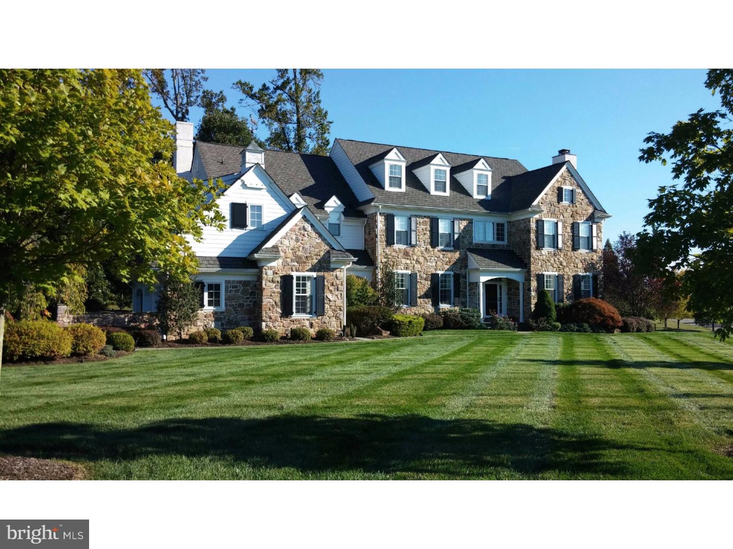Sunlit and welcoming 5 Bedroom 6 and 2/1/2 Bath Estate Home is ideally positioned on 1.48 acres at the end of a Cul de Sac in the desirable community of White Horse. Exciting and freshly styled interior opens to a grand, bright, straight through Foyer with beautifully crafted wainscotting and wide cased transitions, showcasing the formal Dining and Living Rooms on the left and right. Highlighted by warm, site finished, hardwood floors and a honed black slate fireplace surround with contrasting white mantle, this formal Living Room is both elegant and inviting. Adjacent to the large Dining Room find the Butlers pantry with stainless steel wine chiller, granite top serving and richly stained storage and glass display cabinetry. Centrally located and brightened by wrap around windows find a stunning, sparkling, pure white, newly renovated Kitchen with expansive Calcutta Nuvo Ceaserstone seated Island enhanced with designer pendant lighting and streamlined "zero radius" stainless under window sink. Steps away find the solarium styled Breakfast Room with access to the blue stone terrace, gardens, flat yard and built-in, stone surround, gas grill. Open to both the Kitchen and Breakfast Room is a step down Family Room with wood burning fireplace, gleaming white woodwork and full wall of windows. Here find the connection to the outfitted Mudroom, informal 1/2 Bath and 3 car Garage. A handsome Den/Library, detailed with substantial wainscoting,is tucked behind the Living Room and accessed by two sets of french doors making this room ideal for work or quiet conversation. Ascend a gently curved stair to find the Master Retreat. A Sitting Room overlooking the front of property and deluxe Master Bedroom with vaulted ceilings and neutrally tiled Bath offer his and her vanities, deep tub, seated shower and generous his and her closets. Four additional bright bedrooms each with en-suite Baths and outfitted closets, laundry and back stairs complete the second floor. Ideal for informal entertaining find a superior finished Lower Level offering truly incredible recreation space with 10 foot ceilings, custom granite topped seated u shaped wet Bar with built-in mirrored glass shelved display, Lounge and Poker area with surround sound speakers, Billiard Room and full Bath. Double doors open to a tiered/stadium seated Home Theater with overhead projection and built-in screen. A Gym and full Bath complete this level.