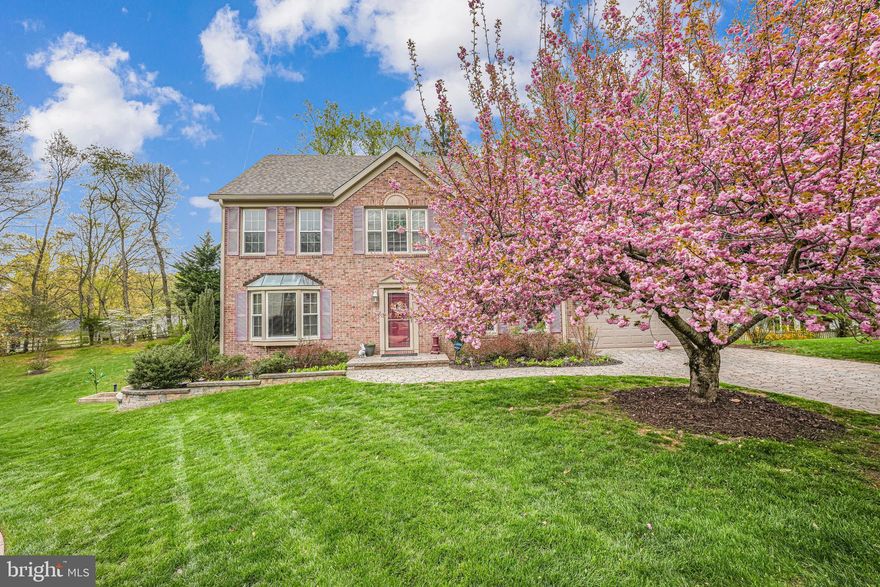 Beautiful Colonial  in Evangel Estates in West Springfield! NO HOA!! Attention to details show in the many upgrades found throughout the home and property. A custom Belgard paved driveway and walkway welcome you home and into your oversized garage with epoxy floors, workbench, and storage space.  New Core-Tec Flooring (2021) throughout, Recently Redesigned Kitchen with Granite, large center Island with storage drawers and bar stool seating, New Wolf cabinets, LG french door refrigerator, Bosch dishwasher, Maytag built in microwave above stove, and gas stove with 5 burners and double convection oven, Double Moher sink with herb garden window.  Kitchen leads to the patio deck through newer sliding Anderson glass doors (2021). Large Family room with gas fireplace.  Formal living and dining rooms provide a perfect setting for more elegant occasions. Upper level has 4 bedrooms and 2 full baths., both recently remodeled and both with pebble rock floors and quartz counters. The primary suite has a sitting/dressing area, dual sinks, skylights, walk-in shower en-suite, and huge custom cedar lined walk-in closet as well as 2 additional closets. Walk into the attic from the rear of the primary walk-in closet for ease of storing those seasonal items!  Murphy bed built-in in the smallest of the additional 3 bedrooms. New (2023) Speed Queen Washer & Dryer on bedroom level.  In the basement is an addition 5th bedroom with cork flooring, full bathroom, large family room, additional storage room with workbench, and cedar lined stairwell storage area. Trex Decking with gazebo (2 shade covers will be left for gazebo) on the rear of the home  provides a quiet retreat to relax and take in the natural surrounding. Recent updates include: Major remodel 2020-22 (kitchen area, primary bedroom), Tankless Water Heater 2021, Core-Tec flooring 2021, Roof & Gutters with Gutter Helmets 2022, Bathroom Remodels 2012, Siding 2013, HVAC 2021.  Close to commuter routes, metro, shopping, dining, Hunt Valley Swim Club, Huntsman Park, South Run Rec Center, local entertainment and so much more!