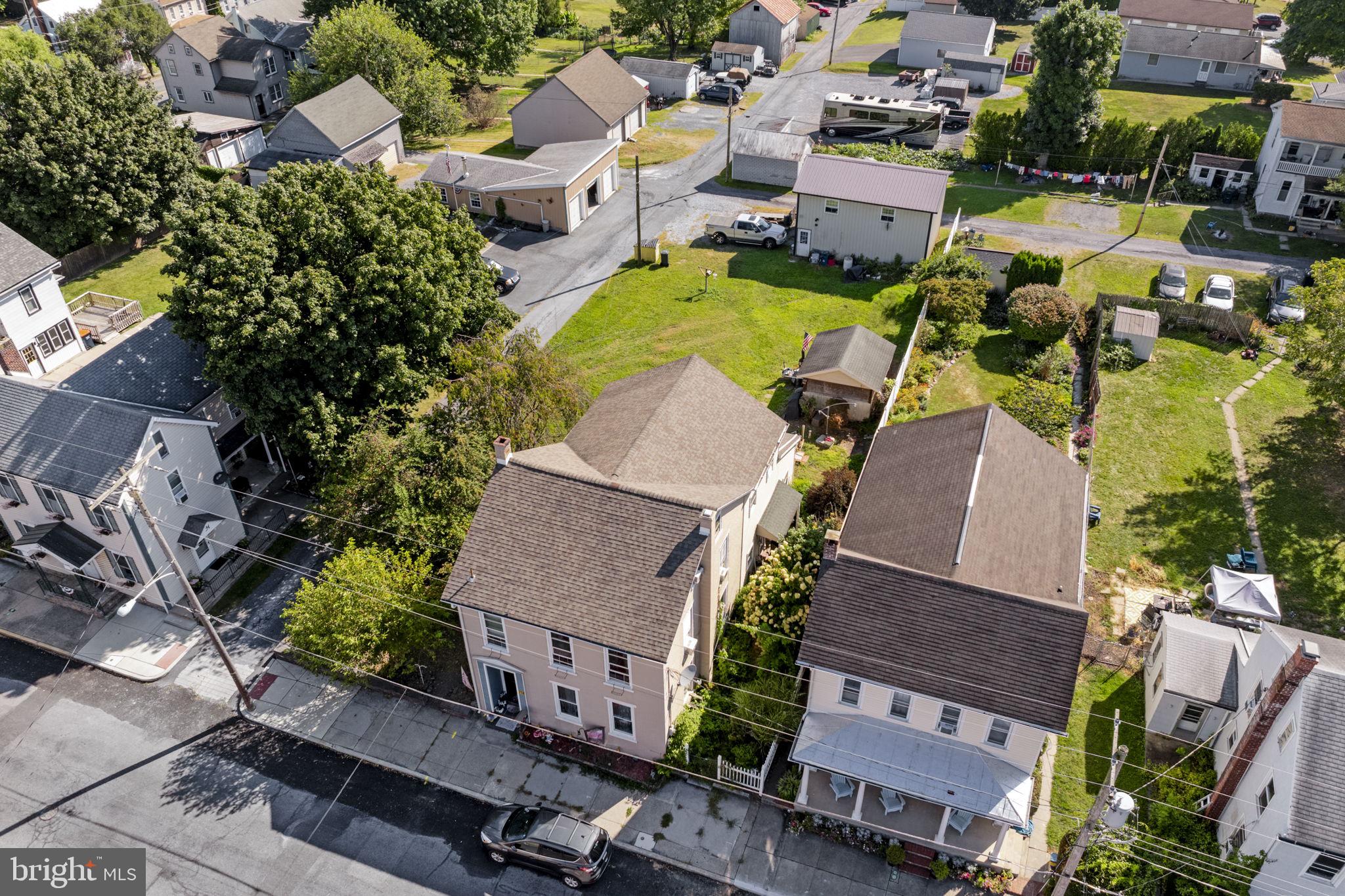 AUCTION DATE - TUESDAY, OCTOBER 14, 2025 AT 4PM. LISTED PRICE IS AN OPENING BID ONLY AND IS NOT INDICATIVE OF THE FINAL SALE PRICE. REAL ESTATE: 2½ story brick/vinyl house w/2212 SF finished area, eat-in kitchen w/appliances, living room w/stone fireplace, 4 bedrooms, 2 full baths, office, foyer w/open banister stairs, kitchenette/mudroom w/French doors to rear deck 24x12, attic, basement w/rec. area & laundry, natural gas forced air heat & insulated windows. Outbuildings: 2 story painted steel 2 car garage/shop 30x22 w/overhead storage & storage shed 14x10 all on level 3/10 Acre corner lot w/alley access, public water & sewer. NOTE: Ideally located solid brick 4 bedroom house w/garage/shop. Ideal as residence or in home business. Convenient location, minutes to many conveniences, Lebanon & Schaefferstown w/easy access to Rts. 422 & 501. Terms 10% down, balance 60 days or before. Personal inspection by appointment or open house Sat., September 27, October 4 & 11 from 1 to 4 PM.