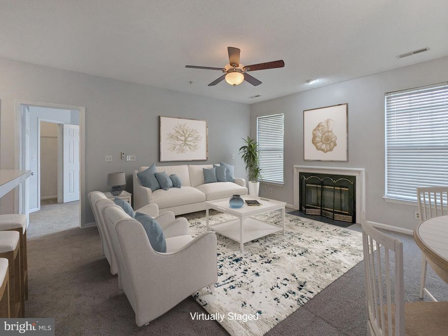 Exquisite, sun-kissed condo unit, designed with your comfort and luxury in mind.  The open floor plan has abundant natural light that bathes every corner, creating an inviting and warm atmosphere. Indulge in the opulent primary suite, featuring a spacious walk-in closet. Pamper yourself in the ensuite bathroom, complete with a garden soaking tub and a separate shower for a rejuvenating spa-like experience.  Prepare your favorite meals in the expansive open kitchen, equipped with newer appliances.  Adjacent is a convenient laundry center for the utmost convenience.  Unwind and gather around the cozy fireplace, adding a touch of charm and warmth to your evenings. Step outside onto the lovely deck, where you can relax, soak up the sunshine, and revel in your own personal oasis.  New carpet and beautiful ceramic plank tiles throughout the unit, exuding sophistication and style. The updated lighting fixtures create a captivating ambiance, enhancing every moment spent in this remarkable space. With a fresh coat of paint, the condo gleams with a renewed vibrancy, ready to welcome you. The building provides secure access, ensuring your safety and peace of mind. Convenience is at your doorstep, with proximity to shopping, dining, and entertainment options. Commuting is a breeze, as this remarkable residence is located close to major commuter routes, saving you valuable time and energy.  Don't miss your chance. Schedule your private tour today and discover a place you'll proudly call home.