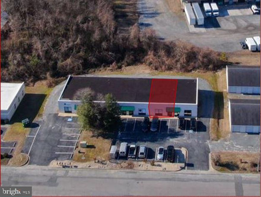 This 1250 SF "contractors slip" is available on August first and  it's ready to be  made into the unit you need for your business. As it stands, this unit offers a large reception area, several private offices or storage areas along with a full bathroom and a large kitchenette.  One of the most prominent features is the roll up rear door. We welcome conversations that include some modifications to work for your needs.