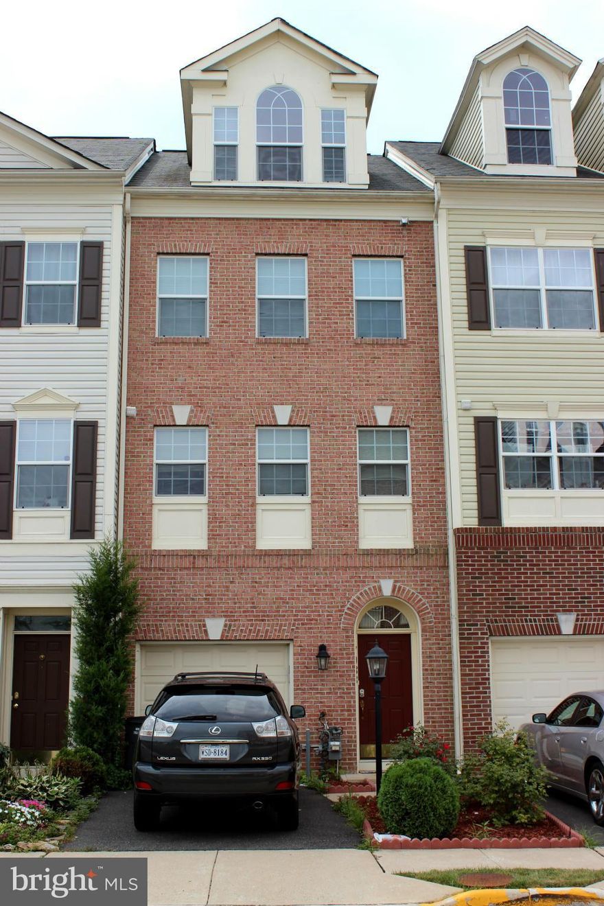 Back on market, price to sell.The largest house in neighborhood, Huge reduction, Motivated seller. Just 8yrs old TH at Avery Park by Brookfield Homes, 4-level- brick front, 3 Master Suites, 1 half bath, Garage. New carpet, & painting. HW on main level and lower foyer, spacious kitchen, corian counters, walk to Costco, Wal-mart, Bus stop. miles away to Metro.