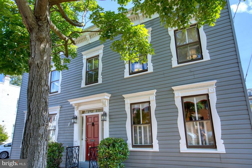 PRICE IMPROVEMENT! Now $1,399,000.      You will be struck by the unique beauty of this stunning light filled circa 1810 detached home on a street lined with townhouses. There are 26 windows in this house!  Come see the wavy glass! Light, light everywhere! Enjoy luxurious living in the amazingly spacious rooms that make up almost 2100 square feet on two levels. Step back in time as you step on to the center hall’s herringbone brick floor. This classic Federal style Colonial also boasts wood floors in  living room, dining room, study and four bedrooms. . The Living Room,  with captivating original brick fireplace and built in bookcases is just inside the front door. A large Dining Room, overlooking the lushly landscaped two level brick walled patio, is a gracious gathering spot. An oversized corner Study/Office on the main level makes working at home a pure delight. It had previously been the Dining Room, so delight in the flexibility of this fabulous floor plan. The updated Kitchen with pantry, stainless steel appliances, granite counter tops, and bead board and beamed ceiling, with recessed lights, also features the herringbone brick floor. A lovely Powder Room, tucked beautifully under the staircase, is a true luxury. The upper level landing and staircase are flooded with natural light streaming through the huge atrium window at the top of the stairs. The Primary Suite features wood floors, recessed lights, two closets and a luxurious marble bath with super-sized walk-in shower. Three additional corner bedrooms, with wood floors and recessed lights, share an impeccable marble hall bath. True modern living is reinforced by an upper level washer/dryer!  And, the location, WOW: less than a block from Washington Street and five blocks to the waterfront! Plus walking distance from award-winning dining, community events, shopping and more. It is also located one block from the route of the city’s most popular parade, The Scottish Christmas Walk. It is tradition for the homes on the route to throw parties alongside their neighbors, invite all their friends and family, and watch the parade go by. You can be in the center of it all AND enjoy the privacy and tranquility of your alluring two level garden.