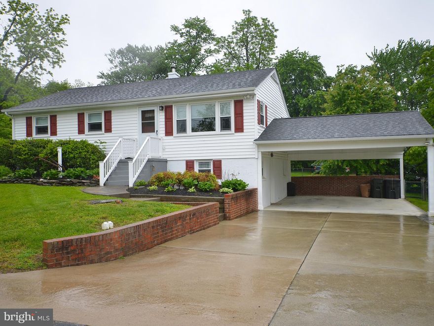 In town living, walk to ball field , school, community center, playgrounds,shops and restaurants.  , one level living with finished lower level. Hardwood floors, nice size bedrooms , eat  in kitchen , deck and fenced rear yard.. Newer roof, windows, and siding , all systems have been routinely maintained, attic is floored with pull down stairs for storage and above carport. Wonderful community .