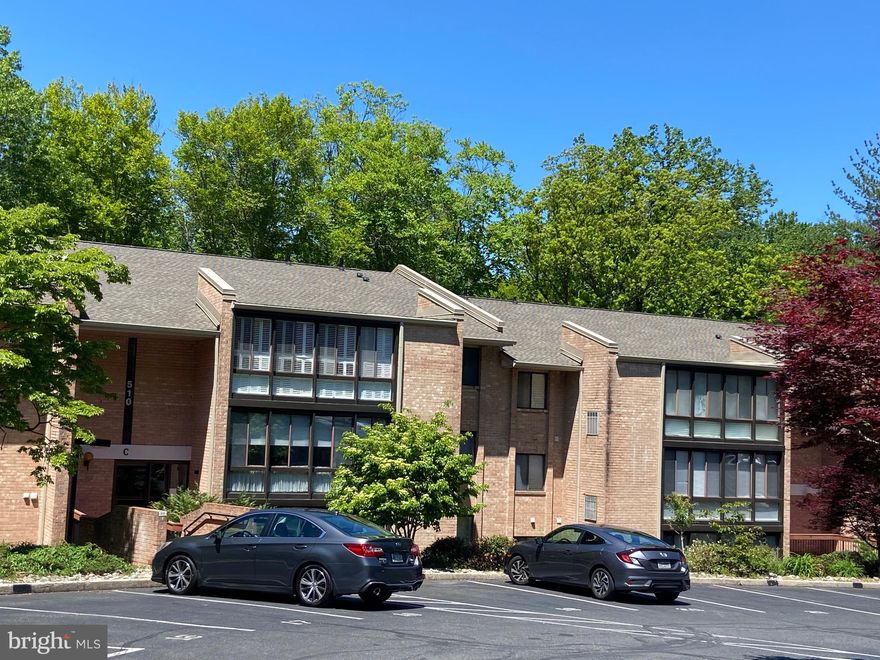 This is a unique opportunity to own a one -bedroom condo in Hickory Hill Condominiums in Media Borough, which was named one of 50 best places to live in the US by the prestigious publication, Money Magazine.           This pristine, 775 sq.ft.one-bedroom condo is accessible through a secure building door that leads you to an art-filled communal hallway.  The mid-century modern Hickory Hill architectural style is reflected inside the unit with newer lighting fixtures and newer neutral colored wall to wall carpeting throughout. There is a private entry area inside the unit with a large coat closet and Moroccan screens that open into the dining area, which is connected to the spacious east-facing living room with loads of natural light. Sliding doors lead to the sun room, which can be used as an office, den, workout/yoga room, studio (whatever you can visualize), and is lined with exposed brick and Plantation Shutters.  The utility closet is connected here with additional storage (5' x7').    The cozy & bright galley kitchen features classic cream cabinetry, offering a clean & timeless look, along with white appliances and plenty of counter space for meal prep.  The roomy bedroom has sliding windows with Plantation Shutters and two large closets;  the bathroom has a tiled bathtub/shower combo, tiled flooring a modern vanity.  The hallway hosts a stacked washer/dryer,  a linen closet/pantry and storage closet with upgraded electrical box  and newer hot water heater (2025)
The condo features central a/c, forced hot air electric heat; water is included. Owner pays electric, internet & cable. No pets, No smoking. No owner / investors. 
This beautifully maintained  complex has reserved parking and additional on site/off street parking for guests, plus space to wash your car on the premises.     This coveted condo unit is a sanctuary in an idyllic woodland setting with mature trees, beautiful landscaping, wildlife and a stream; You can enjoy all of this , but also have the option of going into town for all it offers. It is less than a half mile to State Street, the center of Media, "Everybody's Hometown", and the county seat of Delco, with its acclaimed theater, restaurants, shops and community events.   Media's events, activities and nearby amenities make this condo a special place to live.  The benefits include, Dining Under the Stars; New Year's Eve Ball Drop; America's Music Festival Series; nearby Rose Tree Park with Summer Festival Music Series; Linvilla Orchards; Tyler Arboretum; and Ridley Creek State Park, with it's excellent hiking, biking, and walking trails.    Conveniently located to State Street Trolley, Septa Rails, PHL Airport, Phila, DE, NJ, NYC and all major routes, including I95 and 476 (Blue Rt)