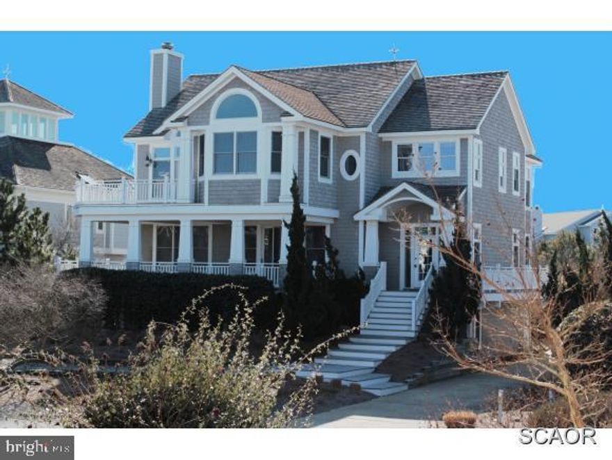 Crafted with the highest level of quality & design, this exquisite home is beautifully appointed with high end finishes throughout.  Offering an impressive great room, family room & multiple decks perfect for large gatherings. Located 2 off the beach with Ocean views in a community w/ pool & tennis.