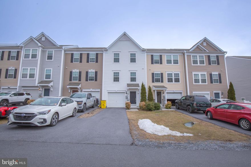 Welcome to this well maintained townhome in the Stonebrook Village Community! 

The entry level features a recreation room/office with walk-out to the unfenced rear yard, washer and dryer, and access to the 1 car garage 

The open-concept main level is filled with natural light throughout the carpeted living room, eat-in kitchen with island and stainless steel appliances, and half bath.

On the carpeted upper level is the primary suite with full bath and walk-in closet, two additional bedrooms, and additional full bath.

The Stonebrook Village Community is located off of WV-9, 10 mins from I-81 exit 16 - just 15 mins from Martinsburg, WV, 30 mins from Hagerstown, MD, and 40 mins from Winchester, VA and Charles Town, WV. 

No Pets.