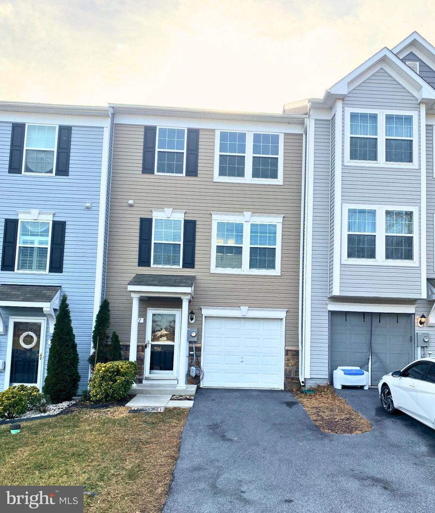 Three-level townhome in Stonebrook Village, Hedgesville, WV. This recently updated home features 3 bedrooms, 2 full bathrooms, and 2 half bathrooms. The ground floor features a family room with laundry and a newly installed half-bath. The second floor includes an open concept living room, kitchen with breakfast area, a spacious deck and half bath. Retreat to the third floor where you'll find the primary bedroom with primary bath and walk-in closet, hall bathroom, and two additional bedrooms. Great commuter location! Minutes from Interstate 81.